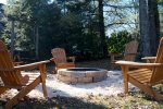 The back yard is a dream with a firepit for s`mores and a swing 